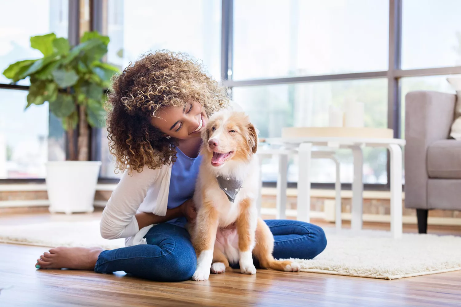 woman playing with her puppy, don't bark at your dog